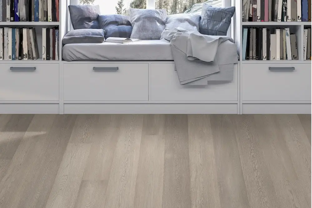 cozy reading nook with light colored oak flooring