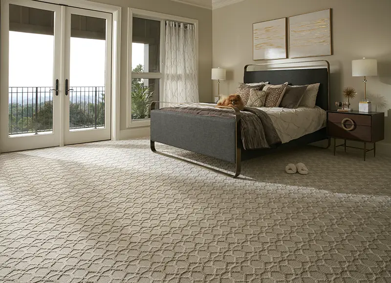 neutral patterned carpet in master bedroom 