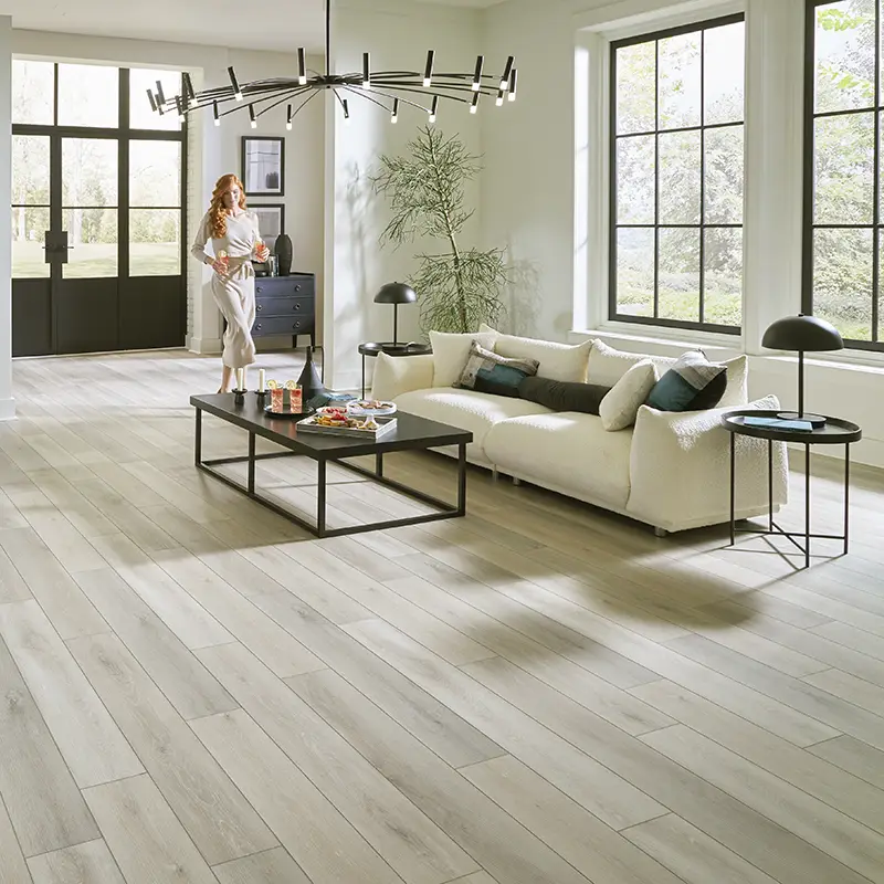 gray luxury vinyl plank flooring in a modern living room 