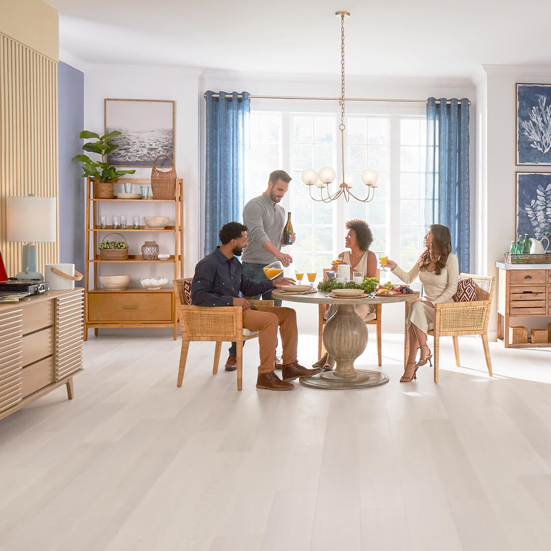 group of people at a kitchen table with a durable flooring option 