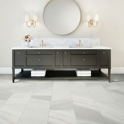 gray luxury vinyl tile waterproof flooring in a bathroom with a modern vanity 